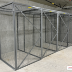 A set of 4 wire mesh storage lockers used for bulk tenant storage in a multi-family building.