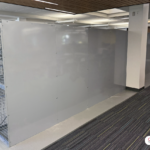 To visually divide the technical office area from the equipment storage area, solid steel back panels were installed on this bank of locker.