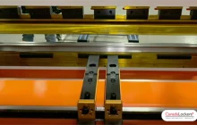 The CNC controlled back gauge of a press brake. This system precisely locates the part relative to the pressing die. The accuracy of this mechanism is critical.